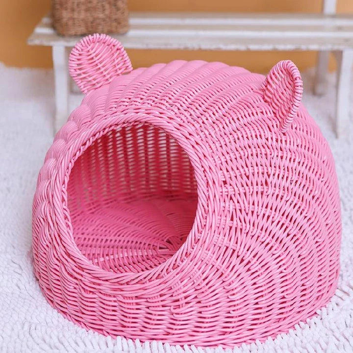 A cozy round woven pet bed made of premium wicker with a soft, plush interior for maximum comfort and style.