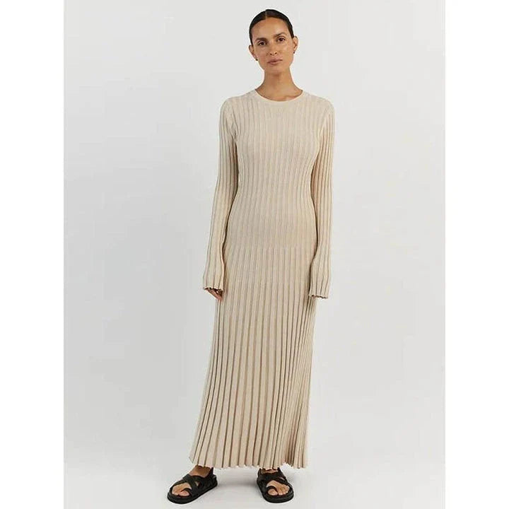 Timeless elegant pleated knit dress in black, perfect for summer office wear with a sophisticated and comfortable design.