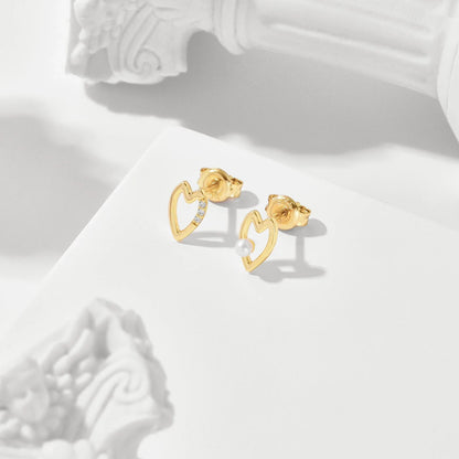 Elegant mini freshwater pearl stud earrings in 925 sterling silver with a sleek geometric design