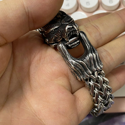 Titanium steel Viking-inspired bracelet with a polished finish and bear design, perfect for modern men seeking a bold, retro-punk accessory.
