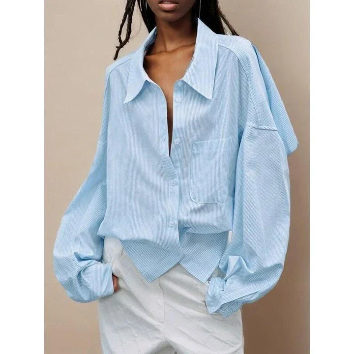 Chic patchwork blouse with functional pockets, perfect for casual and semi-formal occasions