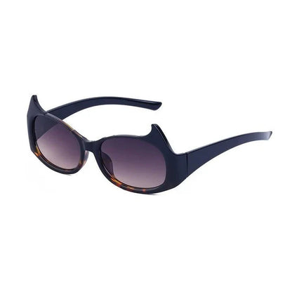 Stylish cat-eye sunglasses with oversized frames, semi-rimless design, and punk-inspired detailing for a timeless, glamorous look