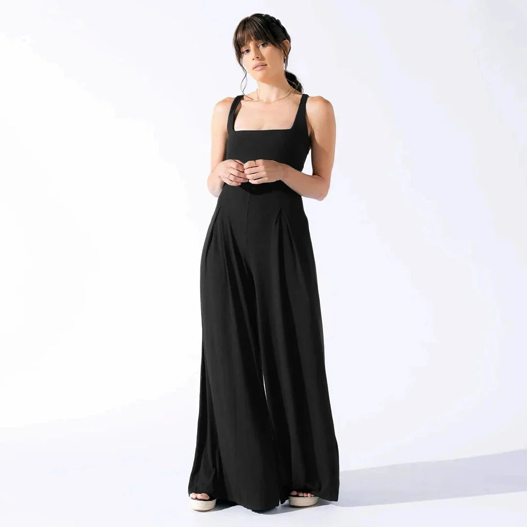 Chic sleeveless jumpsuit with wide-leg pants, made with Rayon and Spandex for comfort and breathability.