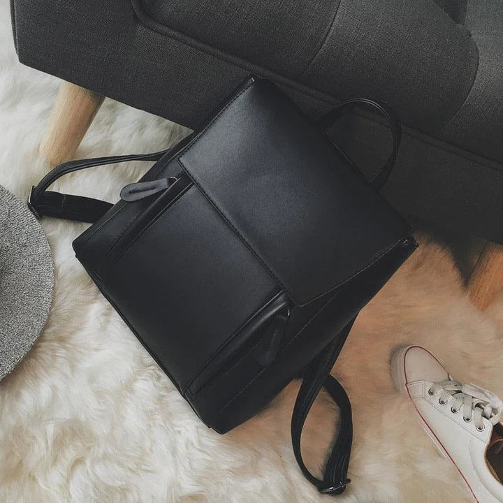 Versatile British-inspired shoulder bag made from high-quality PU leather with a spacious main compartment, convenient pockets, and an adjustable strap