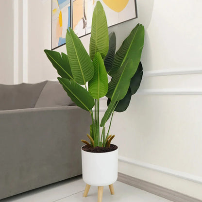 A modern self-watering planter with a wooden stand, designed to simplify indoor gardening and enhance any space with its chic and functional features.