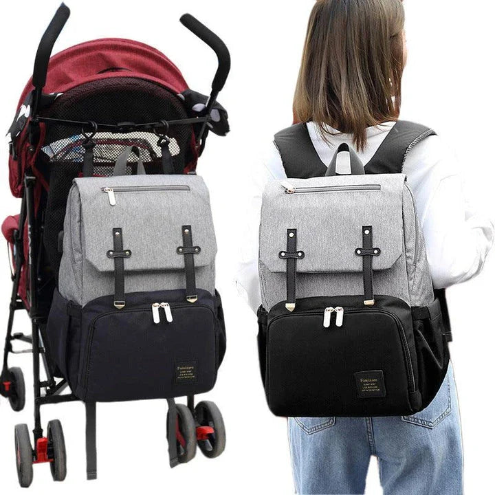 Premium diaper backpack with insulated pockets, stroller attachment, and USB charging port