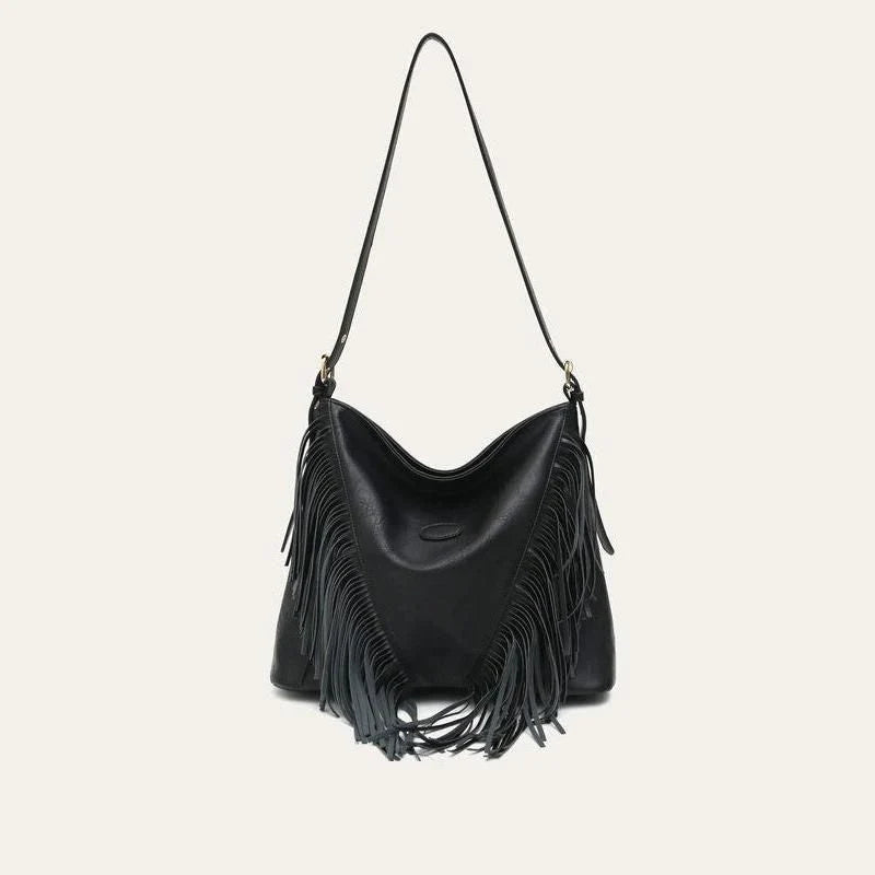 Chic vegan leather shoulder bag with tassel decoration, featuring a spacious interior and versatile carrying options