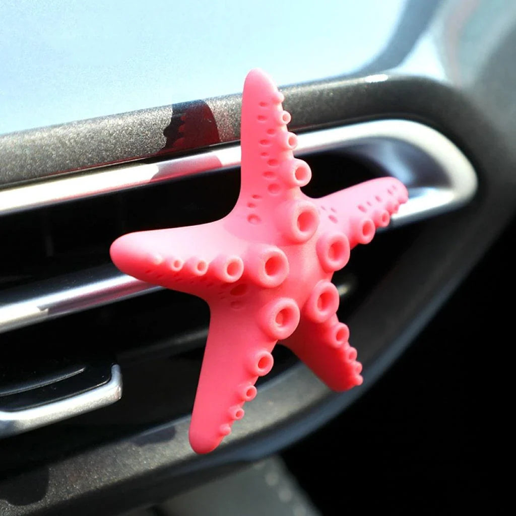 Cute mini starfish car vent air freshener in a rosy-pink color, emitting a refreshing cherry scent