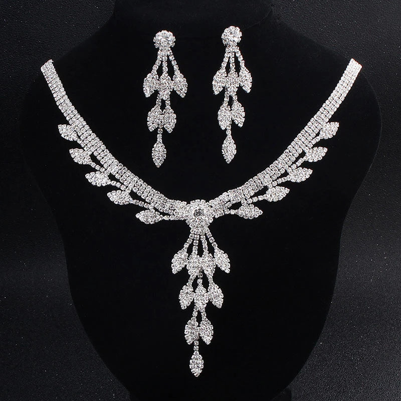 Elegant handcrafted rhinestone jewelry set for women, including a necklace and earrings with a delicate floral pattern and sparkling rhinestones