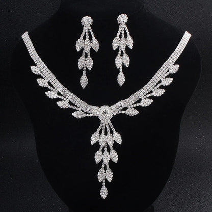 Elegant handcrafted rhinestone jewelry set for women, including a necklace and earrings with a delicate floral pattern and sparkling rhinestones