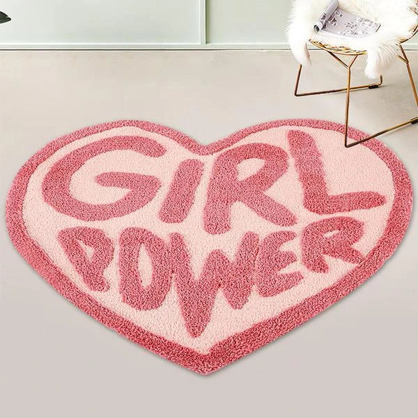 Cozy pink heart-shaped tufted rug with 'GRL PWR' message, perfect for girls' rooms, dressing rooms, and bathrooms