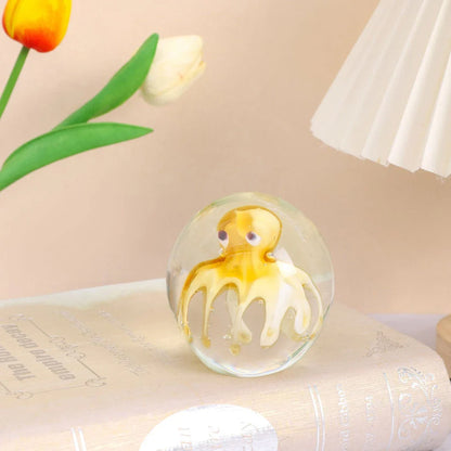 Handcrafted glass octopus decoration for windshield washer fluid, available in ocean blue and tea brown colors