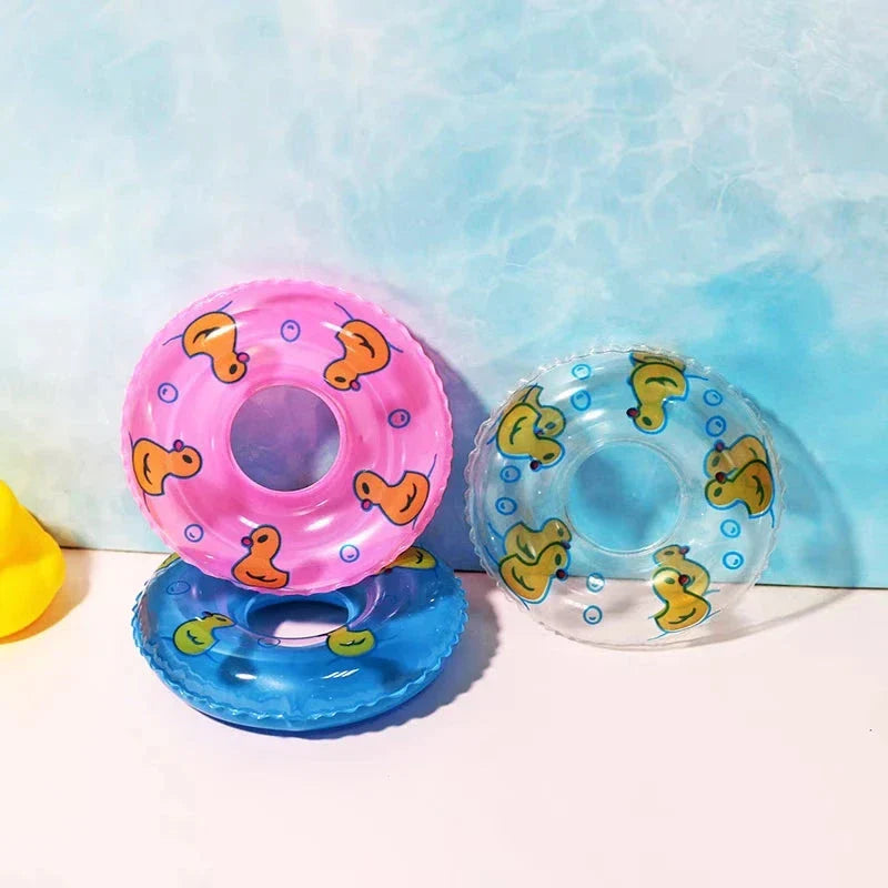 Colorful inflatable swim rings designed to float and entertain children during bath time and pool activities