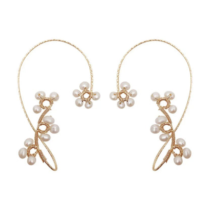 Elegant hand-woven freshwater pearl earrings with a unique geometric design, perfect for adding a touch of sophistication to any outfit.