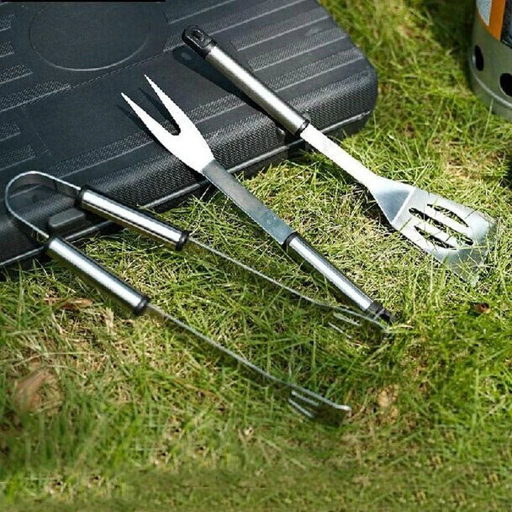 Stainless steel BBQ tool set with fork, tongs, and shovel for outdoor grilling and cooking
