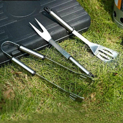 Stainless steel BBQ tool set with fork, tongs, and shovel for outdoor grilling and cooking