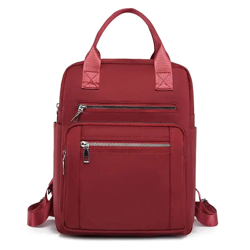 A stylish and durable Oxford cloth backpack with multiple compartments for organized storage and a sleek, portable design.