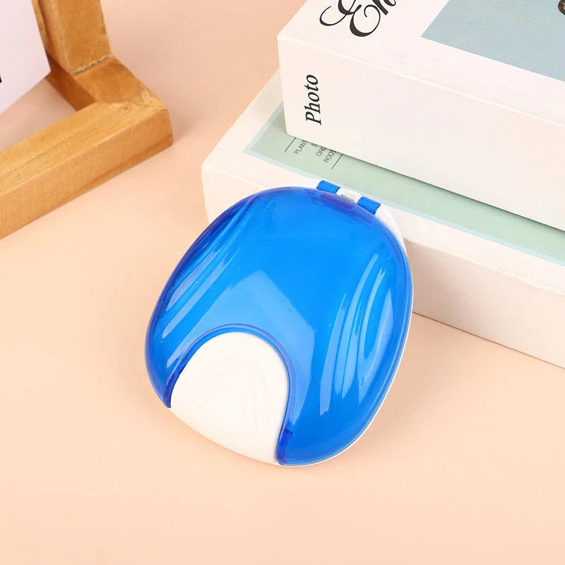 Compact, transparent dental retainer storage box with a push-to-open mechanism for easy access to dental appliances