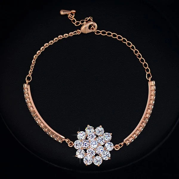 Elegant rose gold cubic zirconia bracelet with intricate cross, crown, and Roman numeral design