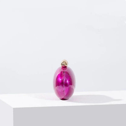 Elegant acrylic rose-colored clutch with delicate diamond-like decorations, perfect for formal events and special occasions.