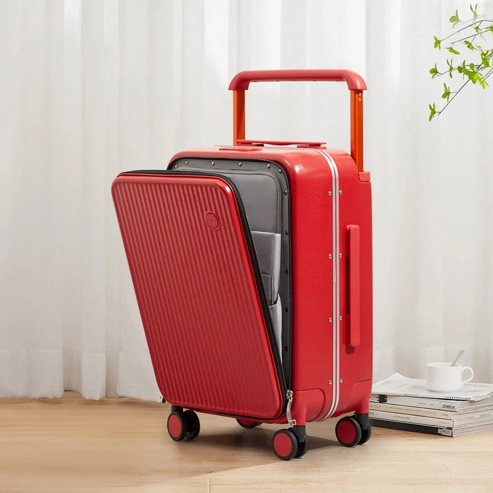 Luxury wide-handle polycarbonate suitcase with front laptop pocket, durable construction, and smooth mobility features