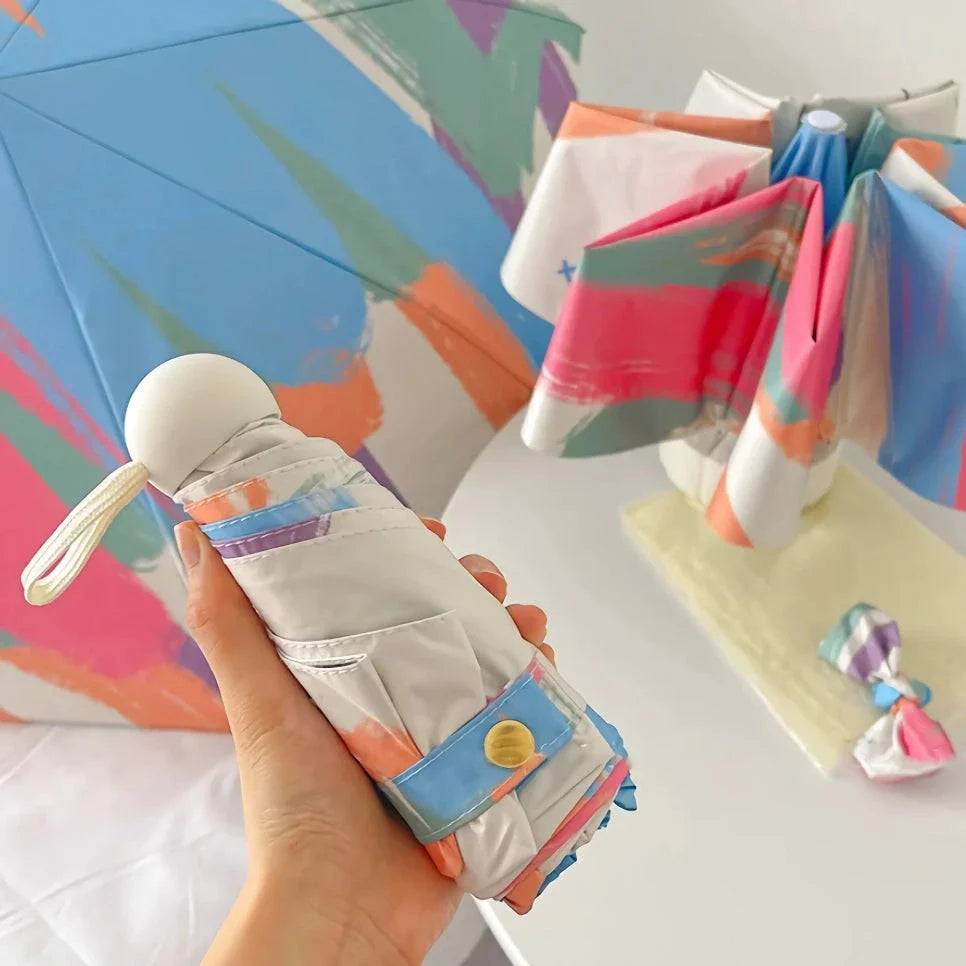 Compact UV Protection Mini Travel Umbrella with black coating and folding design for easy portability