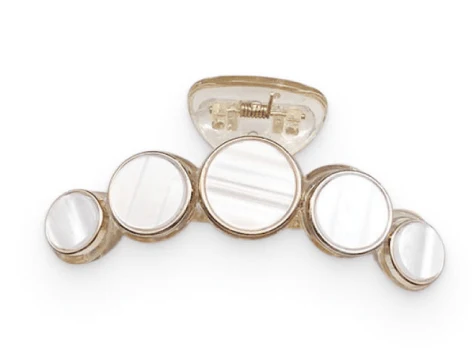 Elegant white marble circle hair claws that add a chic, fashionable touch to any hairstyle