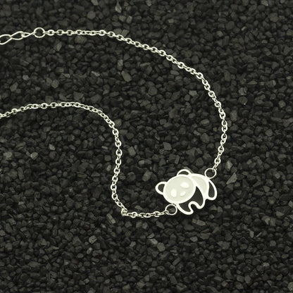 Elegant gold-plated stainless steel bracelet with a delicate panda charm, perfect for fashion-conscious women