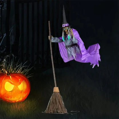 Floating Halloween witch decoration with broom, lifelike facial features, and flowing purple skirt for spooky outdoor display