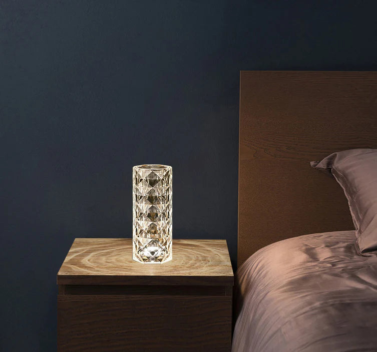 Elegant diamond-inspired crystal lamp with touch-sensitive dimming controls, providing adjustable ambient lighting for bedrooms and living spaces.