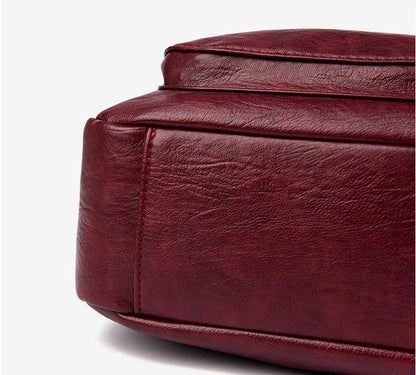 Stylish one-shoulder messenger bag in various colors with a soft, supple PU leather exterior and a spacious, organized main compartment