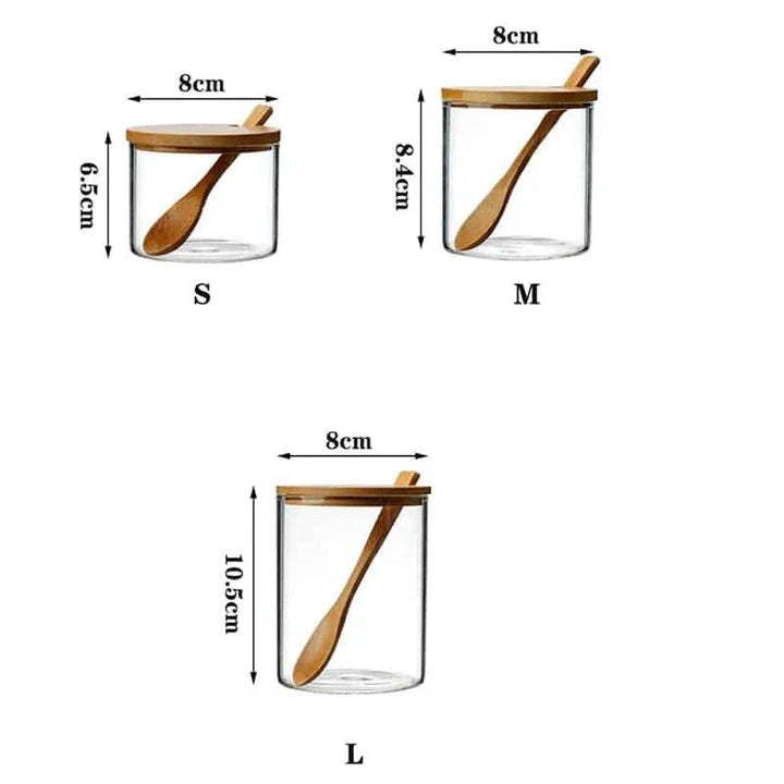 Elegant glass canister with a wooden spoon, featuring a transparent design for easy visibility of contents
