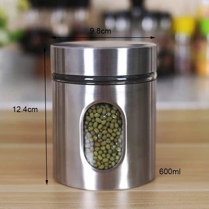 Stainless steel and glass spice jars in various sizes with airtight lids, perfect for organizing and preserving spices in a modern kitchen.