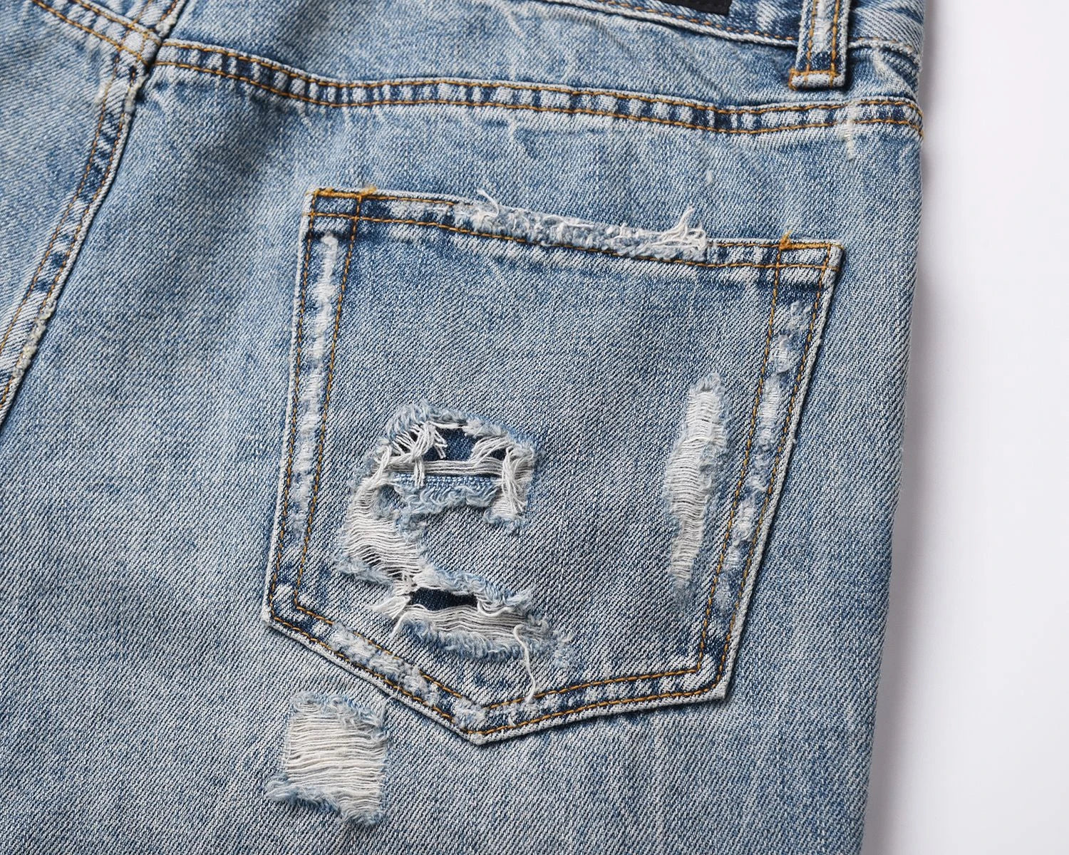 Premium distressed denim jeans with ripped detailing, perfect for casual streetwear style