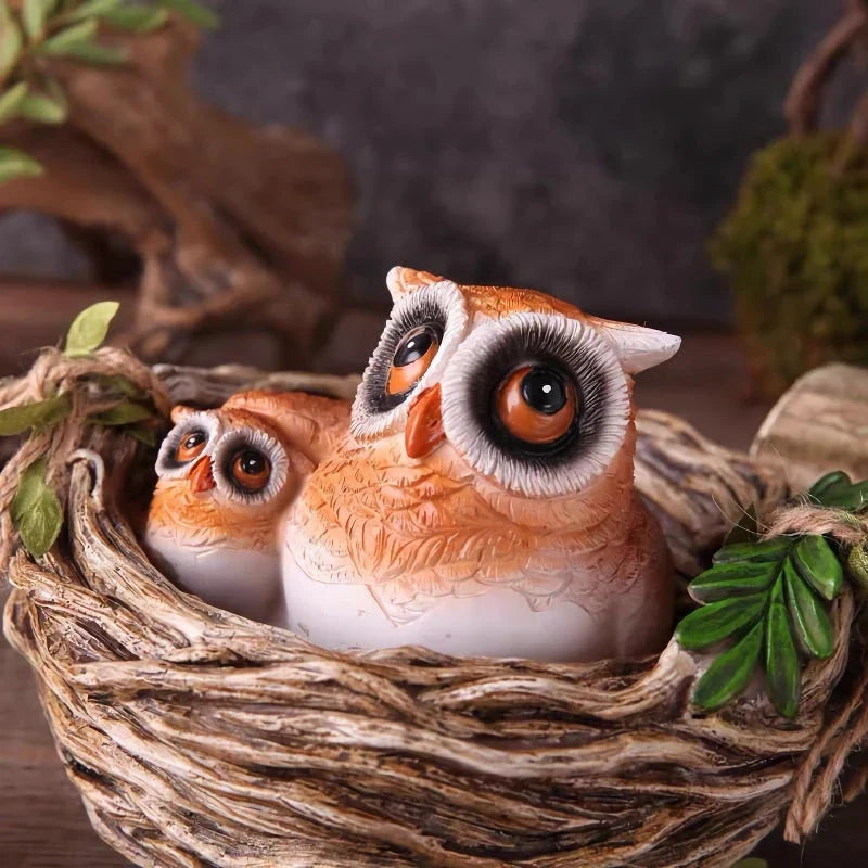 High-quality resin sculpture of a mother owl and her baby nestled in a cozy nest, perfect for adding natural charm to home and garden decor
