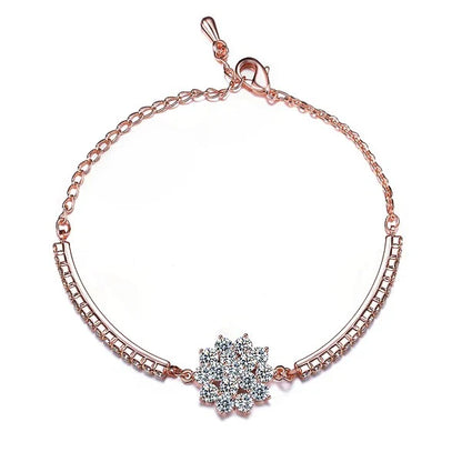 Elegant rose gold cubic zirconia bracelet with intricate cross, crown, and Roman numeral design