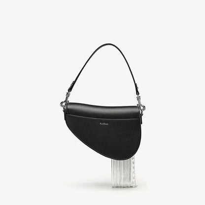 Premium leather crossbody saddle bag with stylish tassel detail, perfect for everyday use or formal occasions.