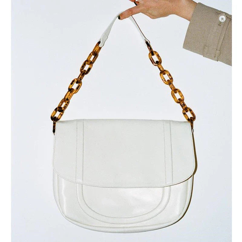 Stylish personalized acrylic chain shoulder bag in a creamywhite color, featuring a versatile tote design with a large capacity interior.