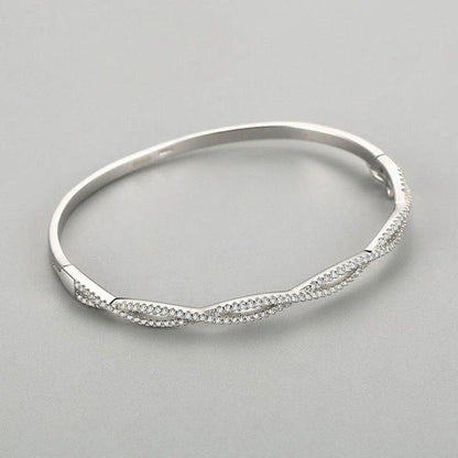 Elegant silver bracelet with a captivating wave-like design, a premium micro-set jewelry piece crafted with superior Seiko technology