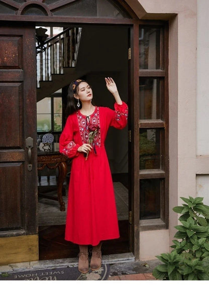 Elegant embroidered cotton-linen dress with tassels, featuring a waist-cinching A-line silhouette in vibrant colors