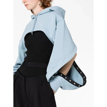 Fashionable hooded sweatshirt for women with open sleeves, asymmetrical decoration, and a relaxed, comfortable fit