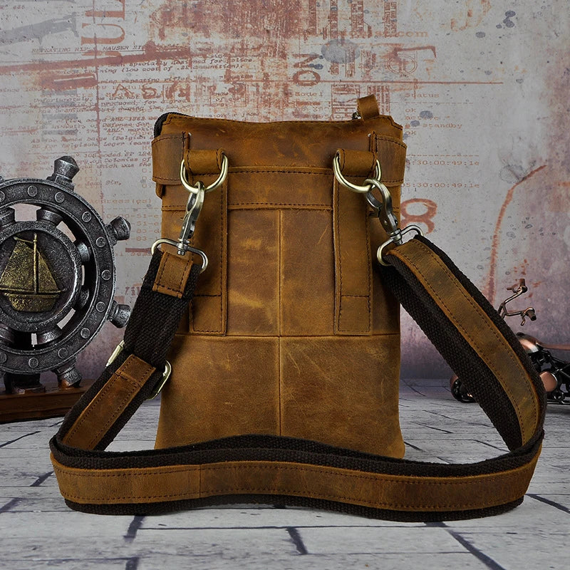 A premium cowhide leather shoulder bag with a compact and versatile design, suitable for various occasions and outdoor activities.