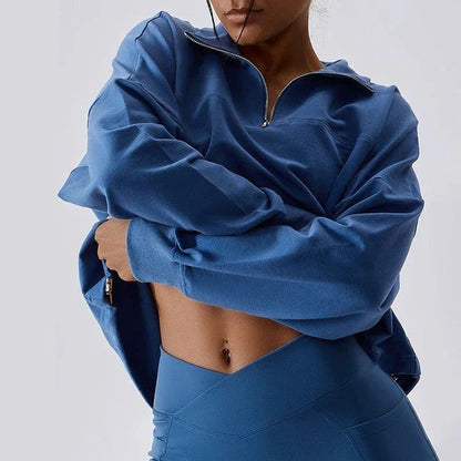 Cozy cotton pullover with zipper detail, available in purple, black, and gray colors