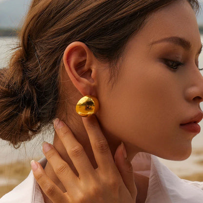 Elegant 18K gold-plated cutout earrings with a sleek hemispherical design, perfect for formal events and everyday wear.