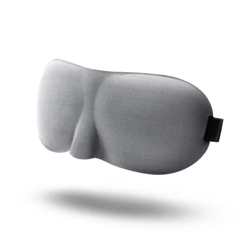 Soft, contoured sleep mask with memory foam construction for comfortable, uninterrupted sleep