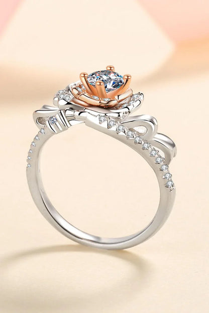 Elegant rose-shaped moissanite ring in sterling silver with a sparkling center stone and zircon accents