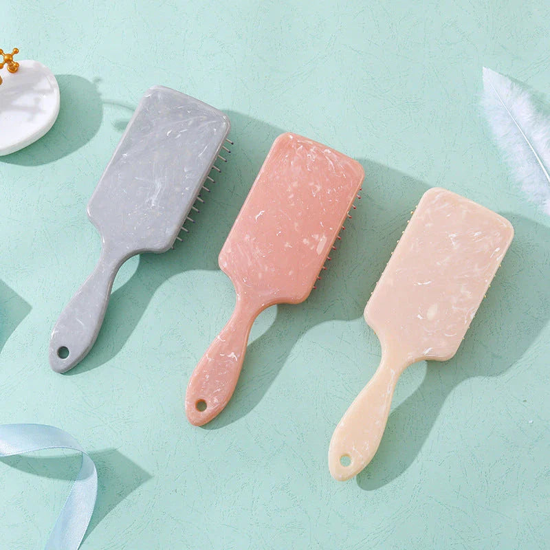 Marble Air Cushion Scalp Massage Hairbrush with air cushion technology for a soothing scalp massage and smooth, frizz-free hair