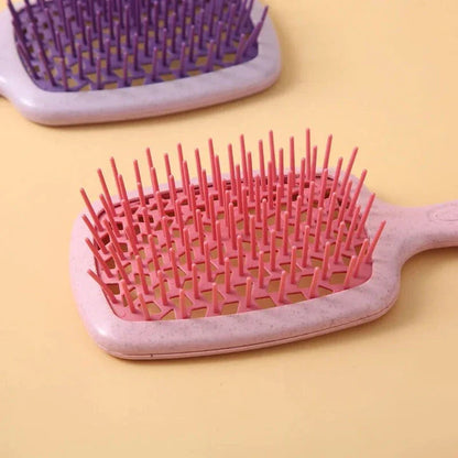DetanglePro Air Cushion Hair Comb in purple, pink, and green colors for effortless hair detangling