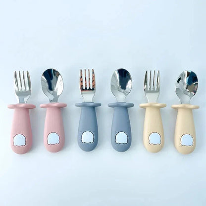 Cartoon Stainless Steel Kids' Cutlery Set with spoon and fork in playful designs, perfect for toddler and child mealtime