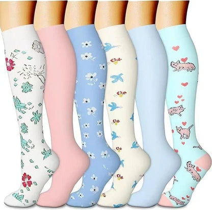 Pairs of long tube compression sports socks in a variety of stylish color combinations